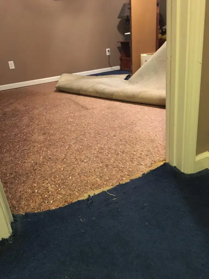 Carpet pad removal revealing water damage during Water Mitigation Services in Soledad