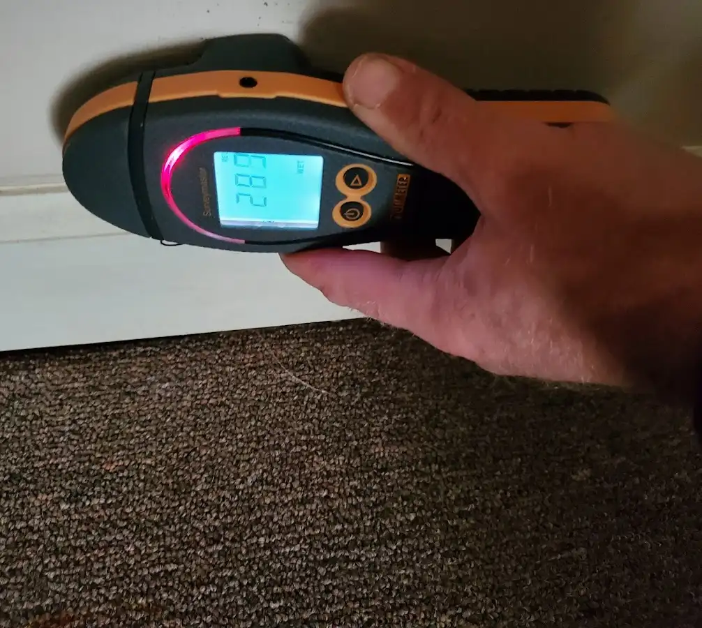 Moisture detection at baseboard during Storm Damage Restoration in Soledad